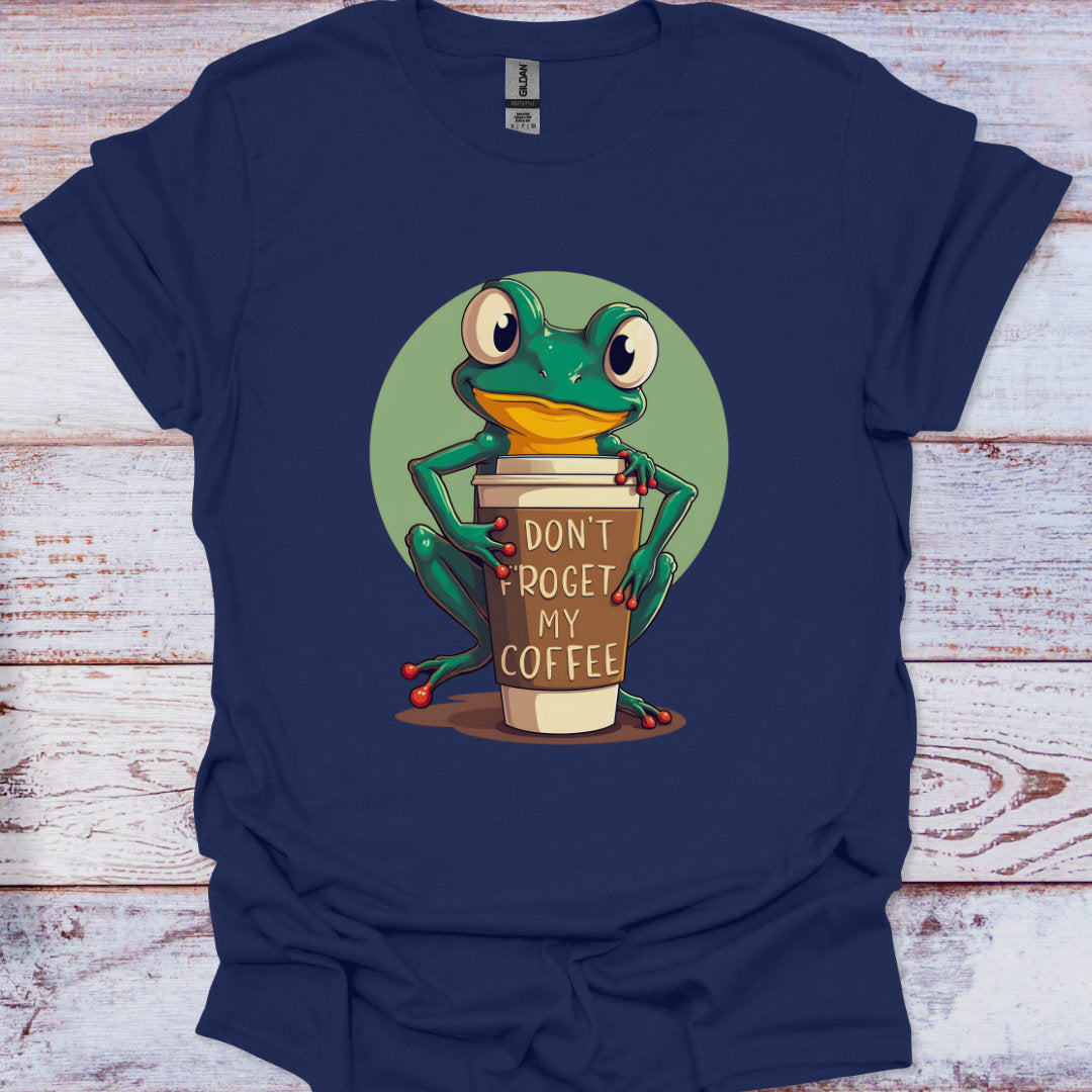 Navy blue t-shirt with a frog holding a coffee cup graphic on a wooden surface