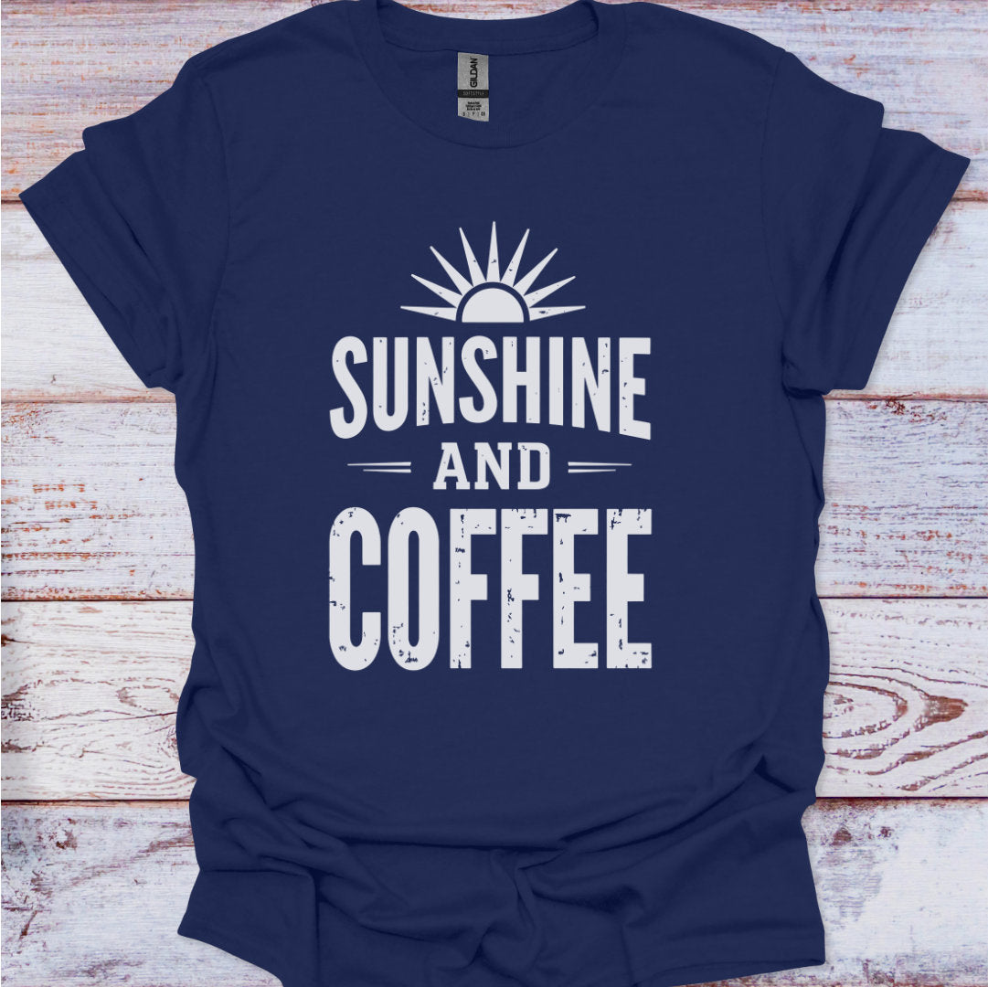 Navy blue t-shirt with 'Sunshine and Coffee' text on a wooden surface