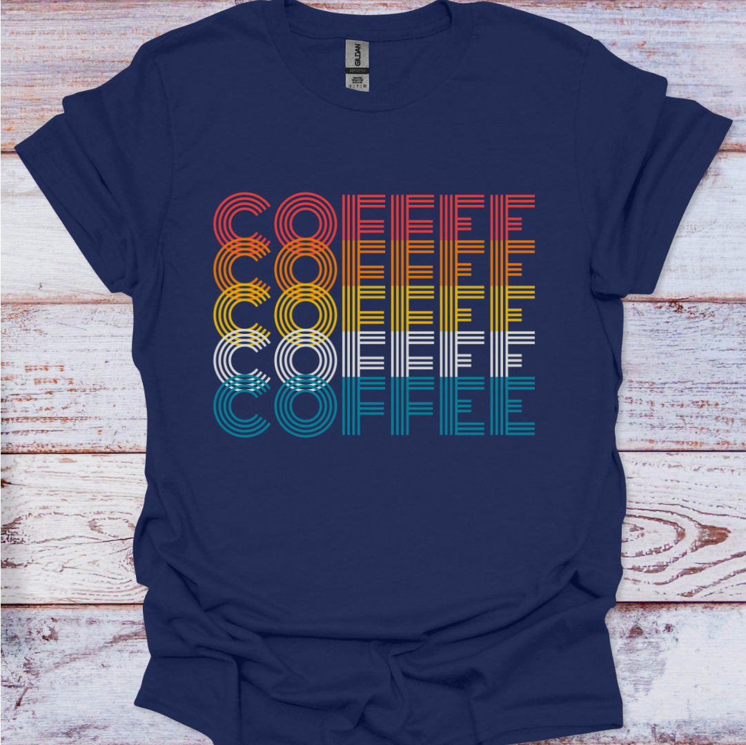 Navy blue t-shirt with colorful 'COFFEE' graphic on a wooden surface