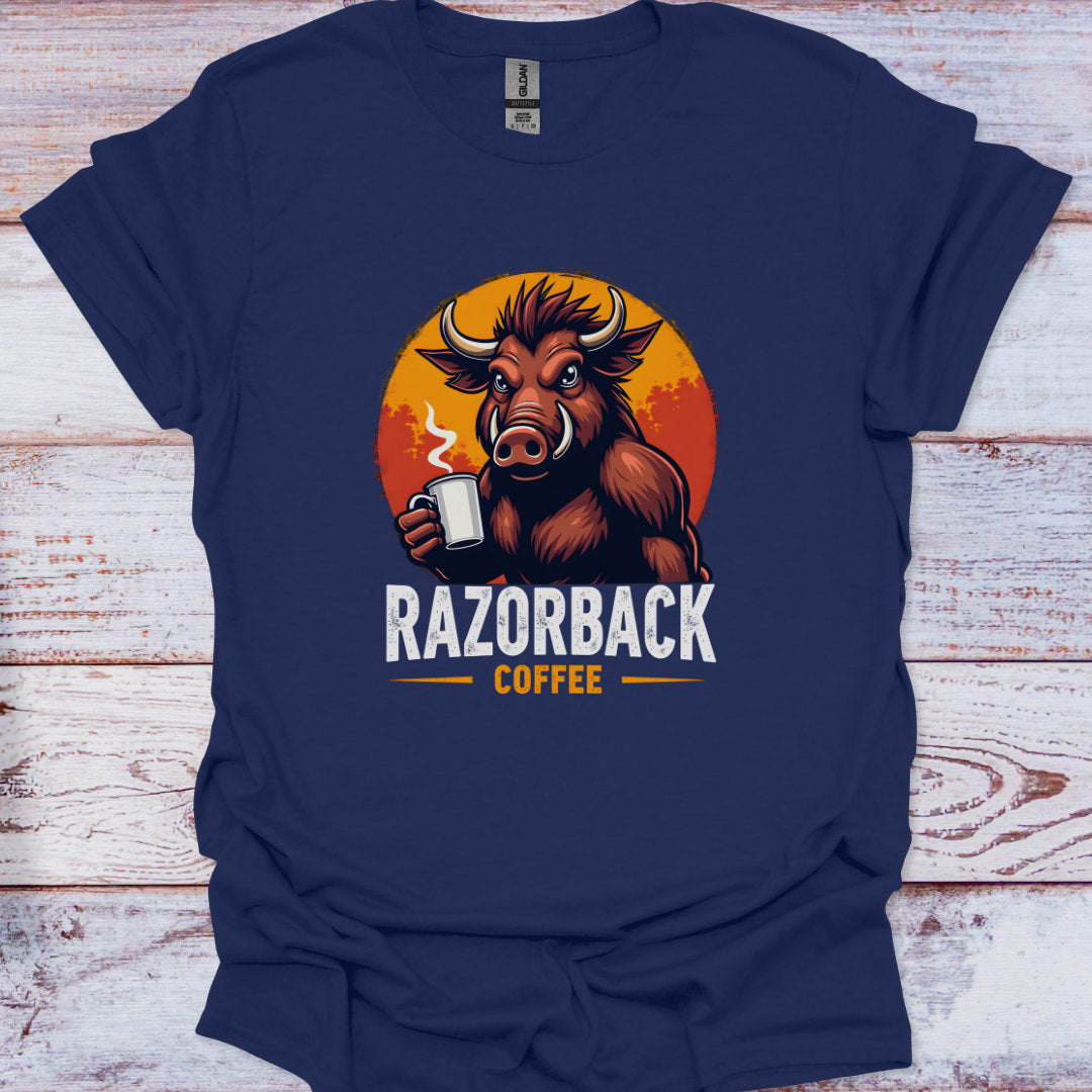 Navy blue t-shirt with a Razorback holding a coffee cup and 'Razorback Coffee' text on a wooden surface.