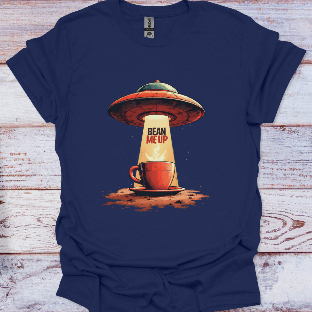 Navy blue t-shirt with a graphic of a coffee cup and UFO design on a wooden surface