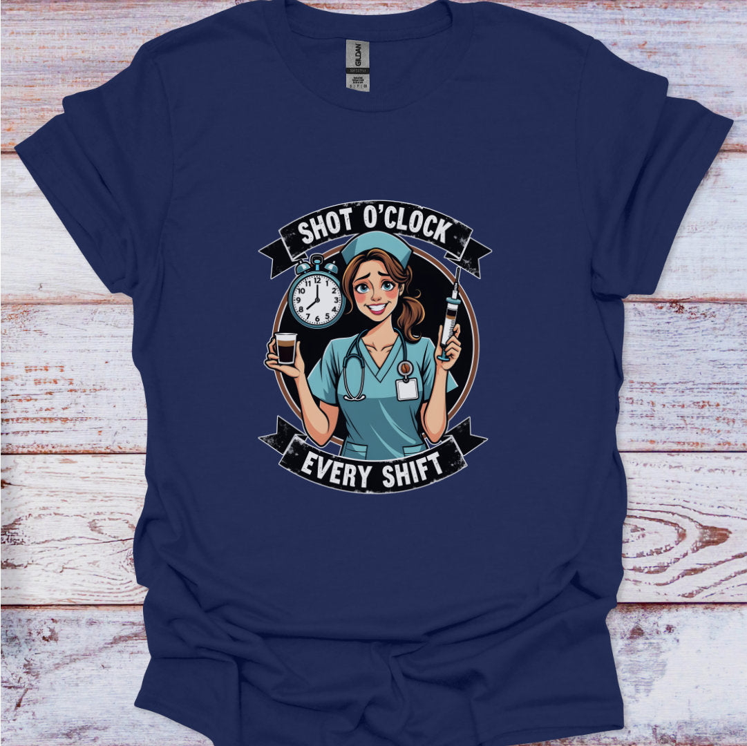 Navy blue t-shirt with a graphic of a nurse and text 'Shot O'Clock Every Shift' on a wooden surface.