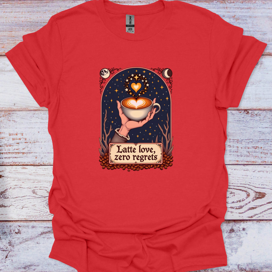 Red t-shirt with a graphic of a hand holding a coffee cup and text 'Latte love, zero regrets' on a wooden surface.