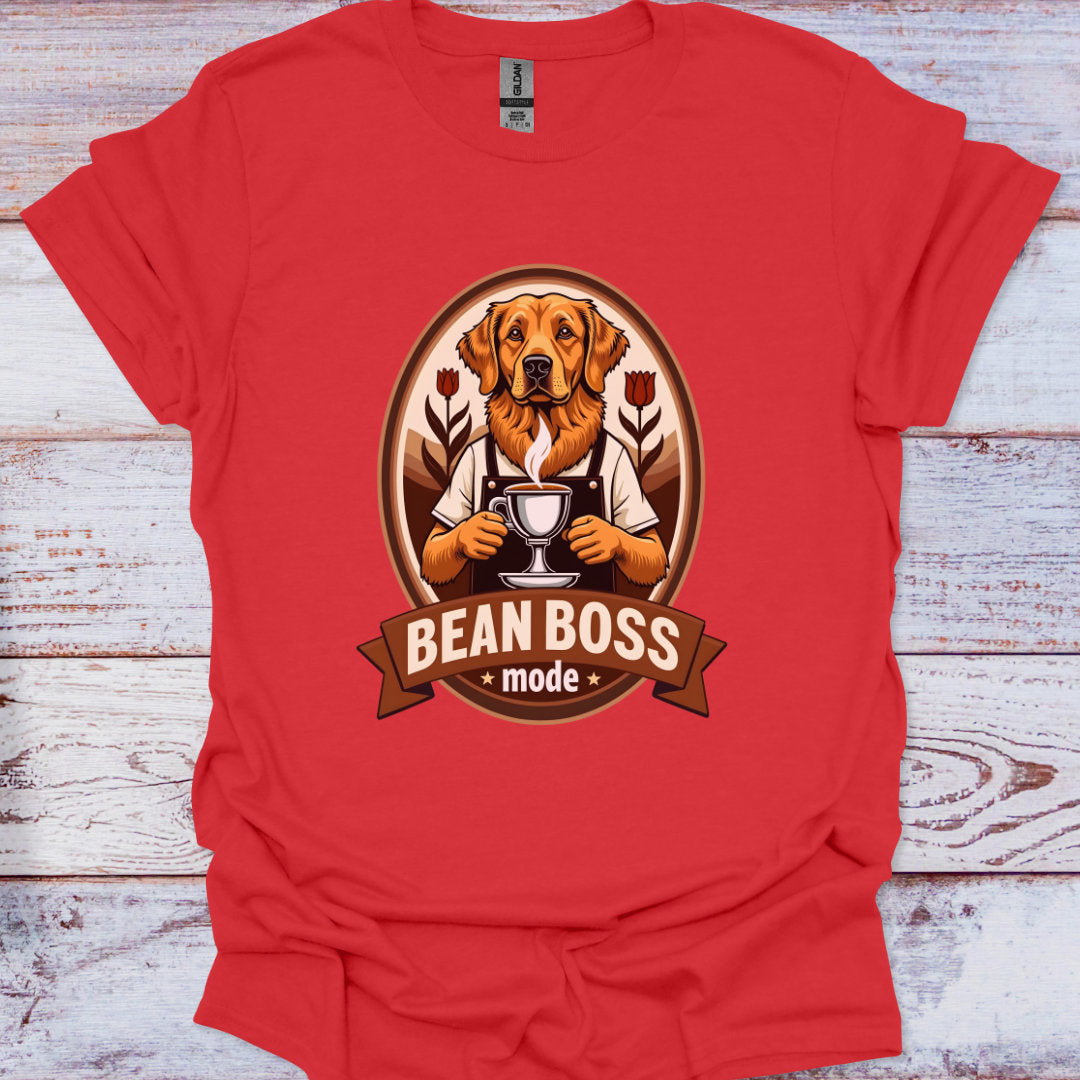 Red t-shirt with a dog graphic and 'Bean Boss mode' text on a wooden surface