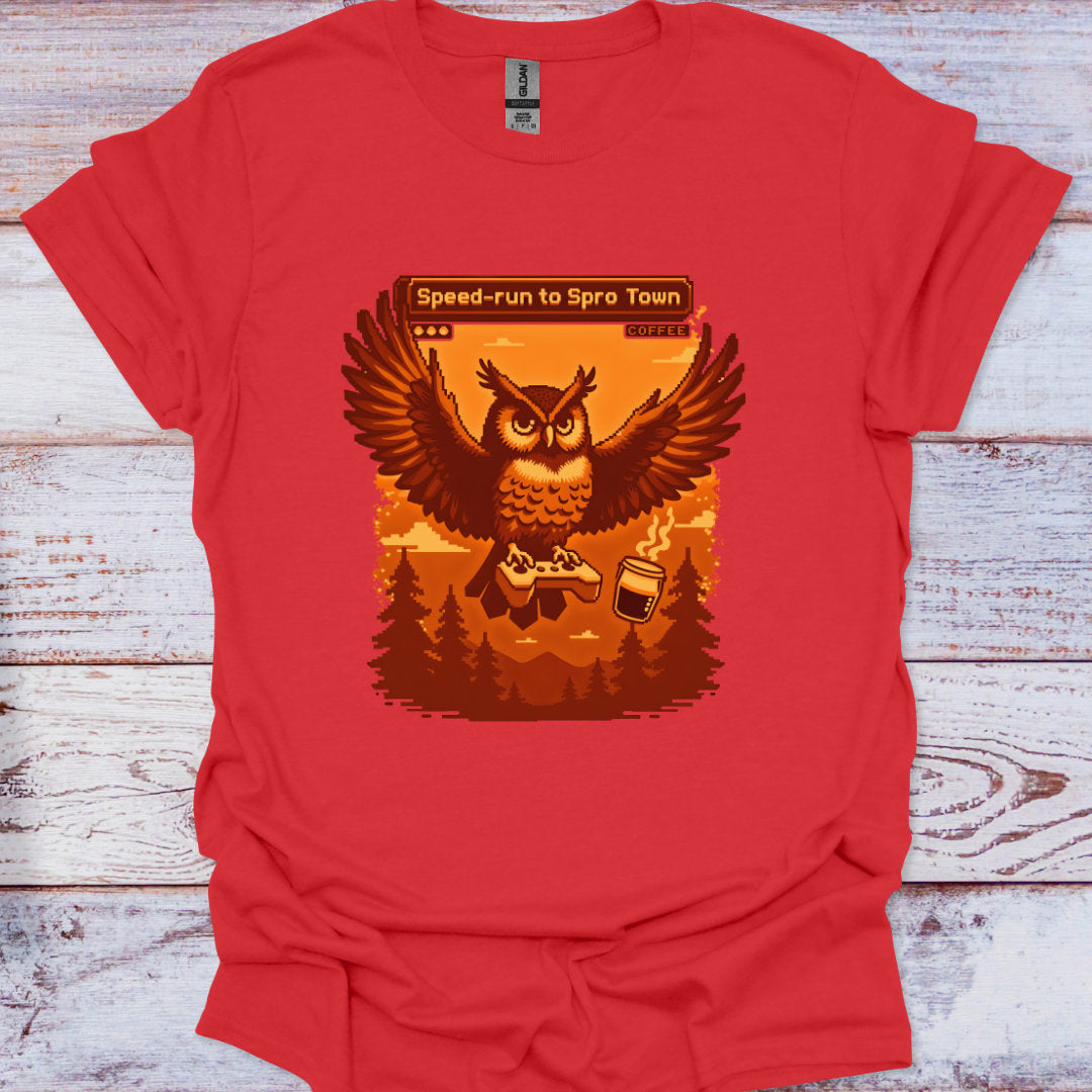 Red t-shirt with an owl graphic and text on a wooden surface
