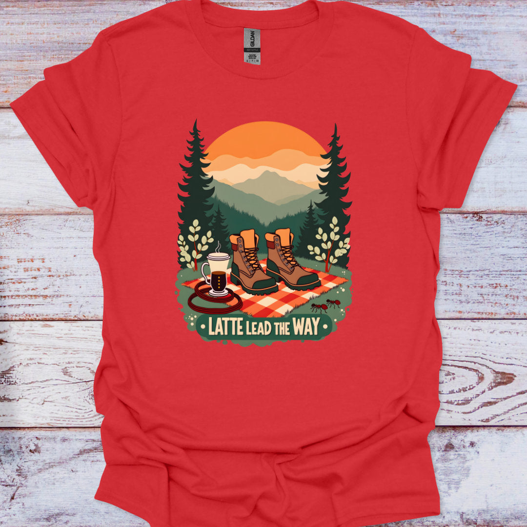 Red t-shirt with a graphic of hiking boots, a coffee cup, and trees on a wooden surface