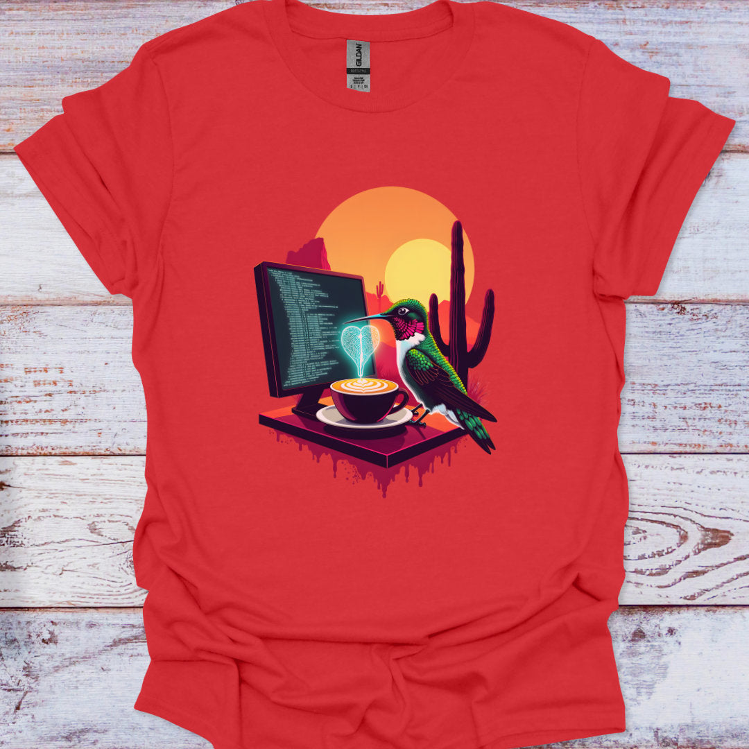 Red t-shirt with a graphic of a hummingbird, computer monitor, and cactus on a wooden surface