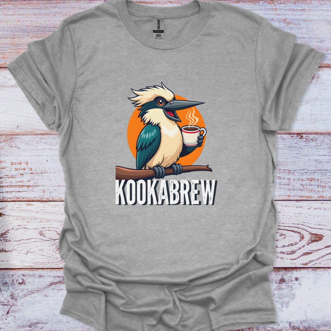 Gray t-shirt with a cartoon kookaburra holding a coffee cup and 'Kookabrew' text on a wooden surface