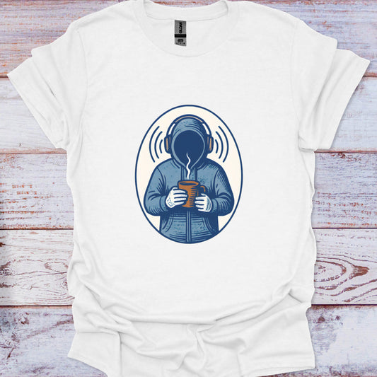 White t-shirt with a graphic design of a person in a coat holding a mug, on a wooden surface.