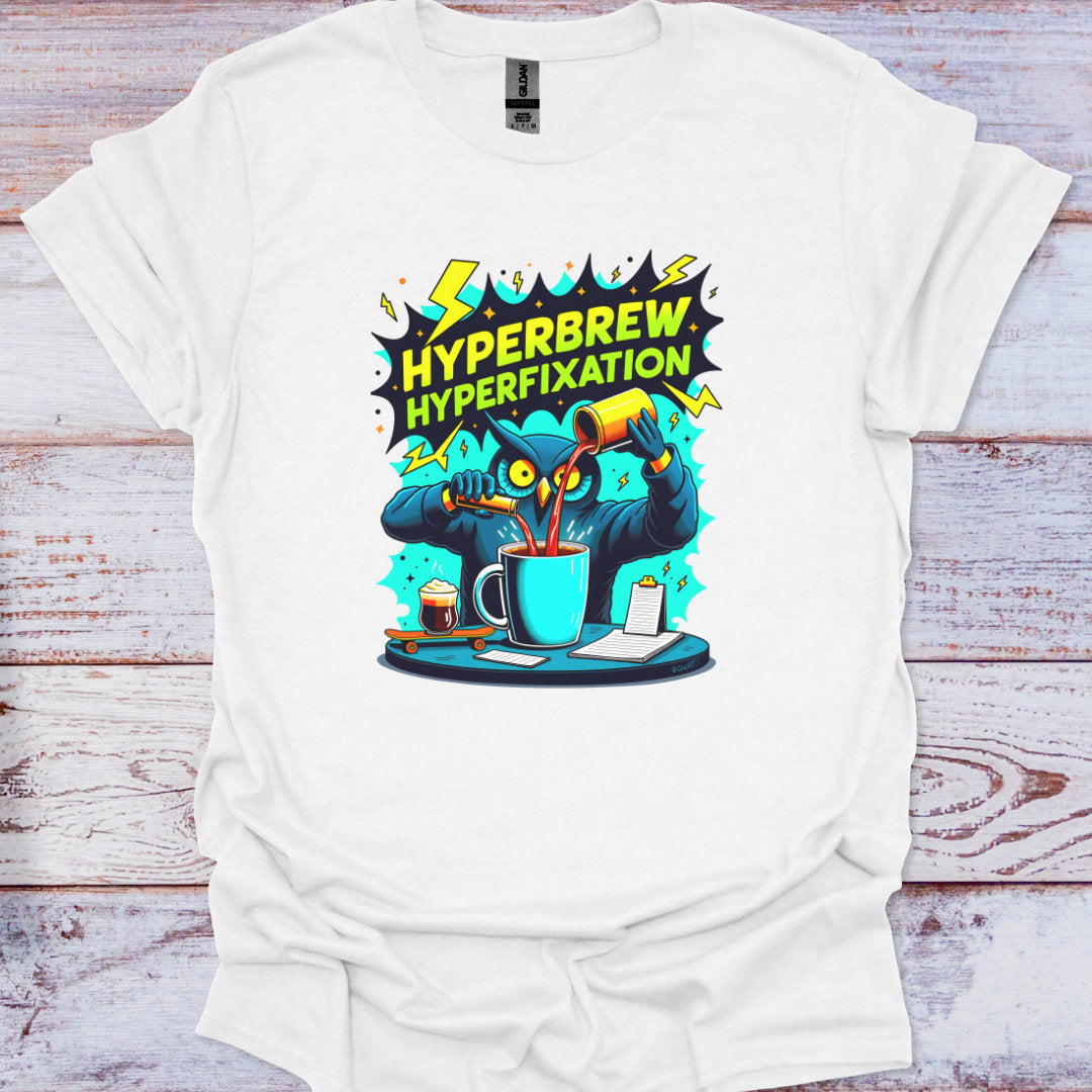 White t-shirt with 'Hyperbrew Hyperfixation' graphic design on a wooden background