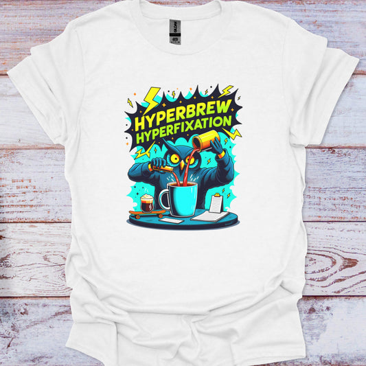 White t-shirt with 'Hyperbrew Hyperfixation' graphic design on a wooden background