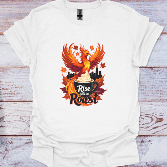 White t-shirt with a phoenix design and 'Rise from the Roast' text on a wooden surface