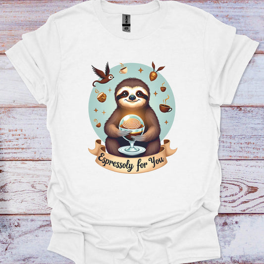White t-shirt with a sloth holding an espresso cup graphic on a wooden surface