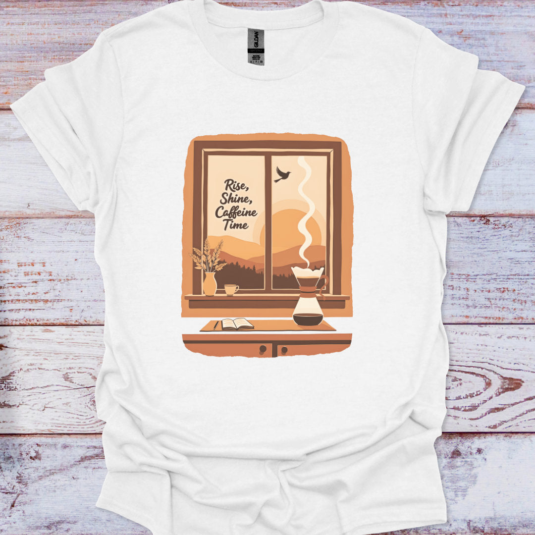 White t-shirt with a graphic design of a coffee maker and text on a wooden surface
