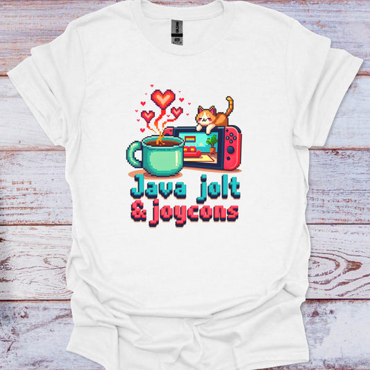 White t-shirt with a graphic design featuring a coffee cup, game console, and cat on a wooden surface.