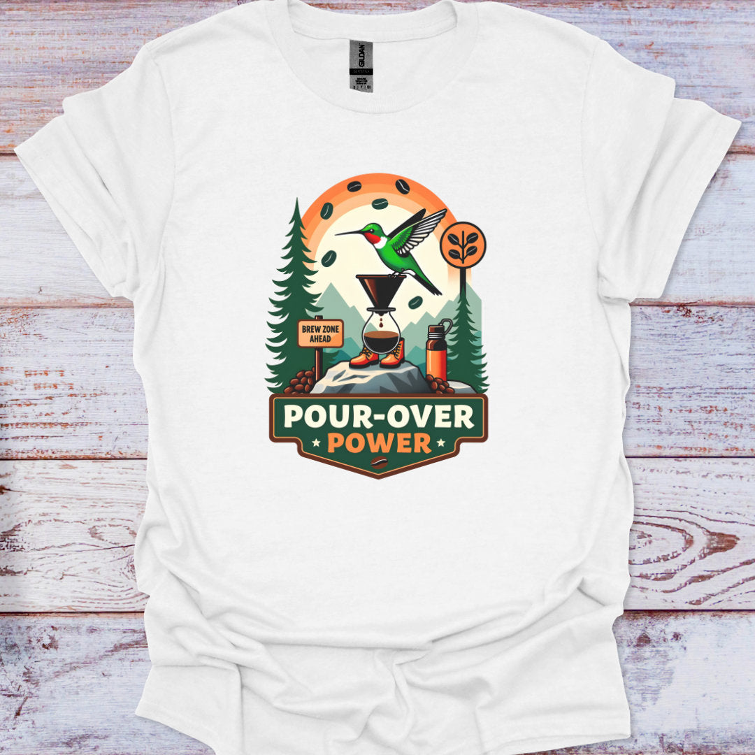 White t-shirt with a graphic design featuring a hummingbird and trees on a wooden surface