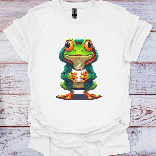 White t-shirt with a cartoon frog design holding a cup on a wooden surface