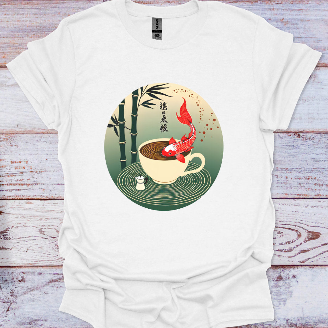 White t-shirt with a cup and koi fish design on a wooden surface