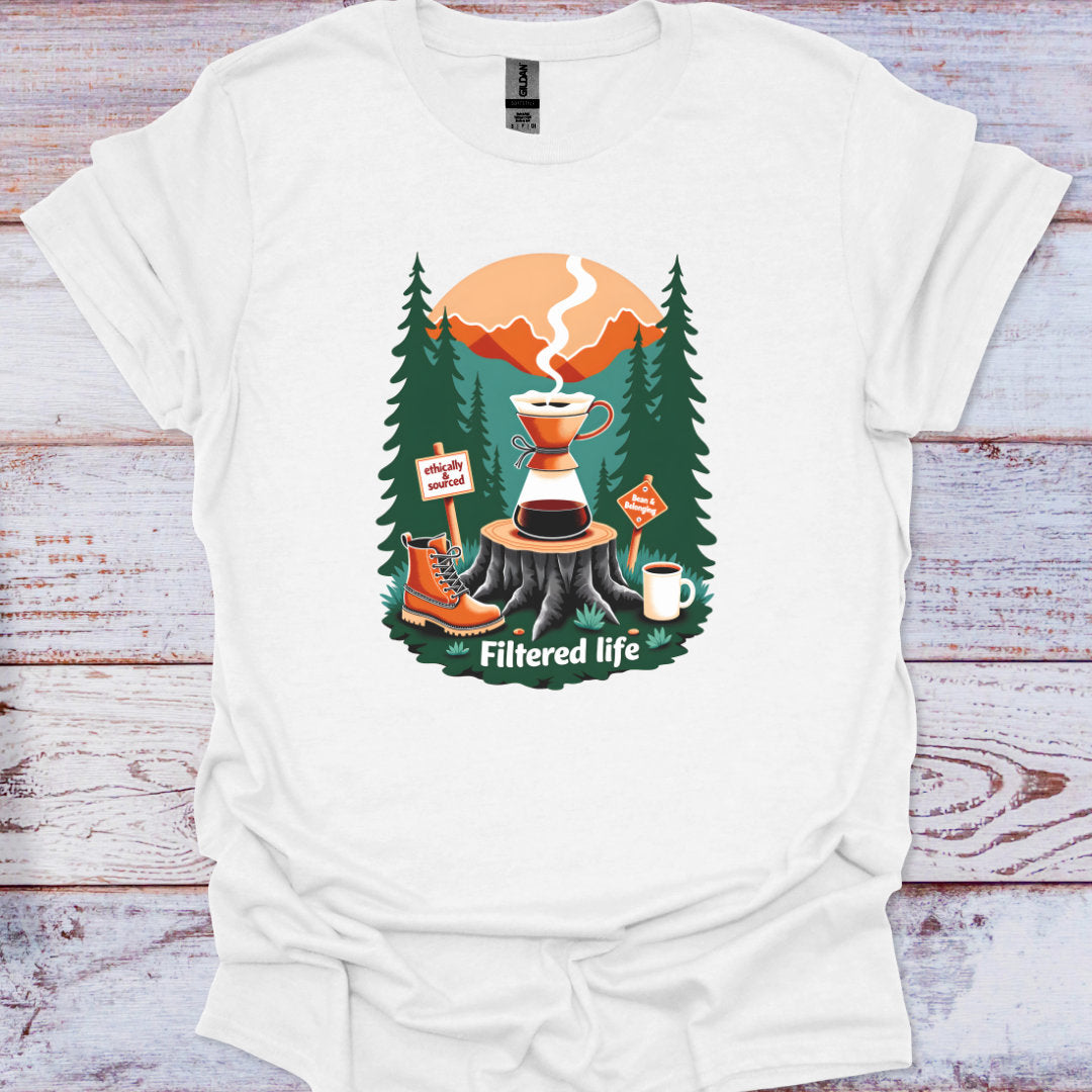 White t-shirt with a coffee-themed graphic on a wooden surface
