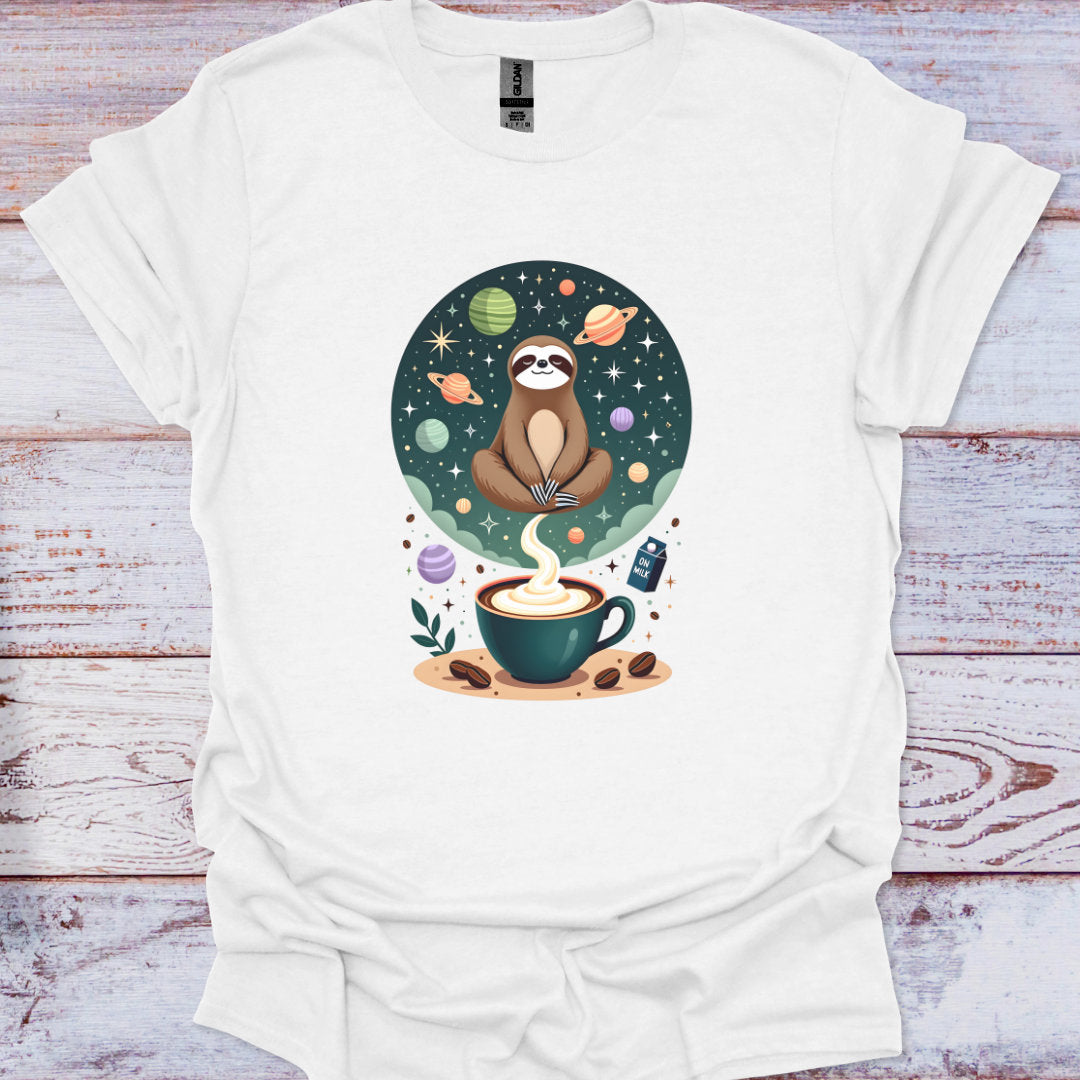 White t-shirt with a sloth and coffee cup design on a wooden surface