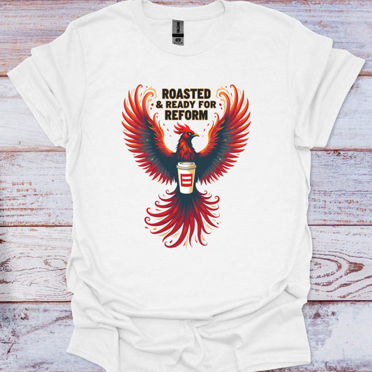White t-shirt with a red and black phoenix design and text on a wooden surface