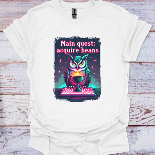 White t-shirt with an owl graphic and text on a wooden surface