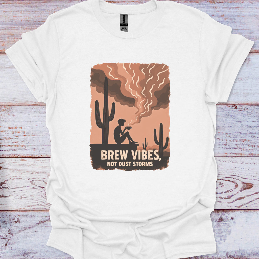 White t-shirt with a graphic design featuring a cactus and text on a wooden surface