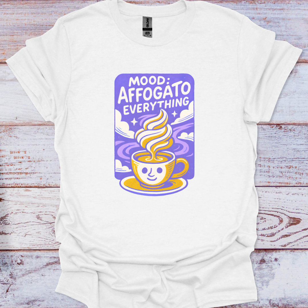 White t-shirt with a colorful graphic design on a wooden surface