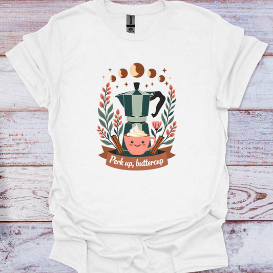 White t-shirt with a coffee-themed graphic and 'Perk up, buttercup' text on a wooden surface.