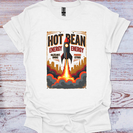 White t-shirt with a graphic design of a rocket and 'Hot Bean Energy' text on a wooden surface.