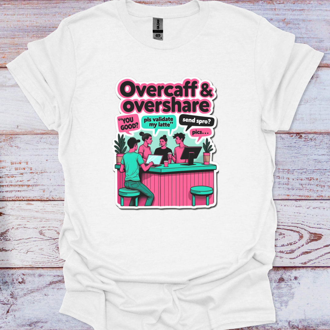 White t-shirt with a graphic design featuring people at a bar and text 'Overcaff & overshare' on a wooden surface.