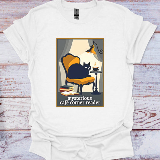 White t-shirt with a graphic of a cat in a cafe and text 'mysterious cafe corner reader' on a wooden surface.