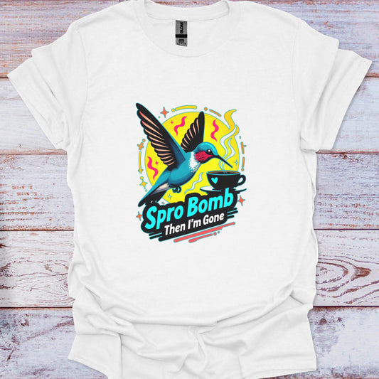 White t-shirt with a colorful graphic of a hummingbird and text on a wooden surface