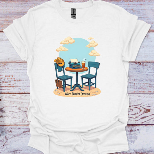 White t-shirt with a graphic design of a table with chairs, a hat, and a drink on a wooden surface.