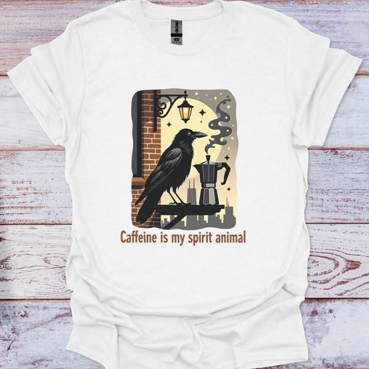 White t-shirt with a graphic of a crow and coffee maker on a wooden surface