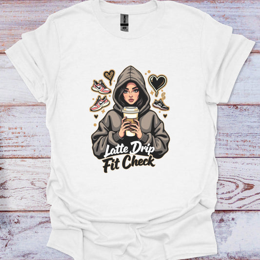 White t-shirt with graphic design of a person in a hoodie holding a coffee cup, surrounded by hearts and shoes on a wooden surface.