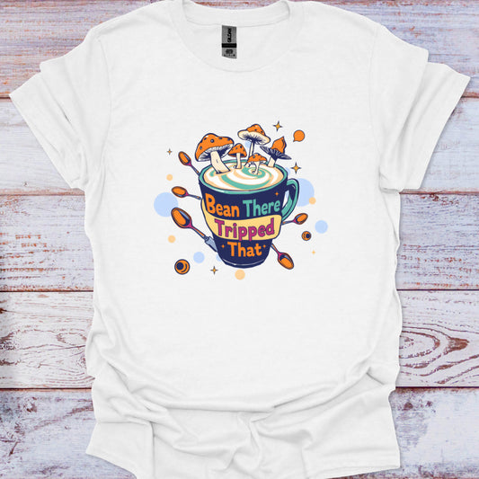 White t-shirt with a colorful graphic design on a wooden surface