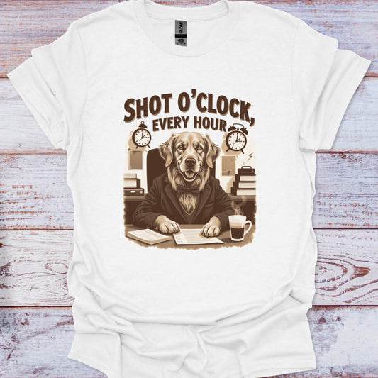 White t-shirt with a graphic of a dog at a desk and text 'Shot O'Clock, Every Hour' on a wooden surface.