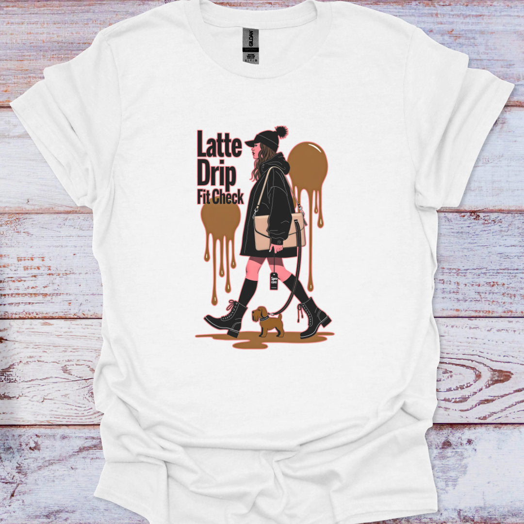White t-shirt with a graphic design of a woman holding a coffee cup and text 'Latte Drip Fit Check' on a wooden surface.