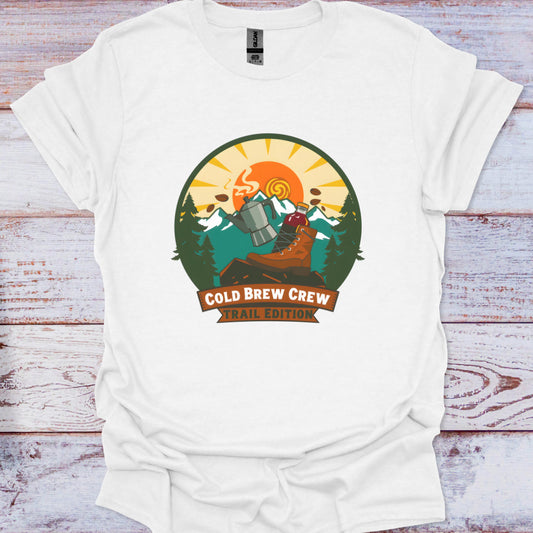 White t-shirt with 'Cold Brew Crew' graphic design on a wooden surface