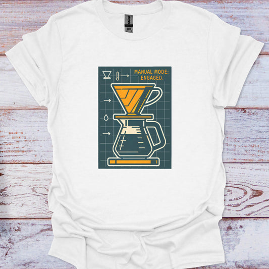 White t-shirt with a coffee brewing graphic on a wooden surface